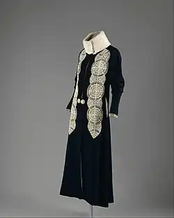 Coat in black wool with fur and leather applique (1919)