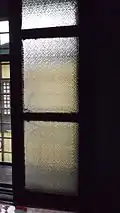 Patterned glass windows at the dining area