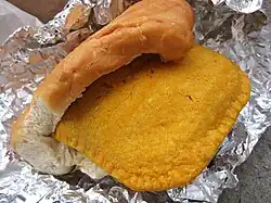 A Jamaican patty wrapped in coco bread