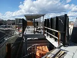 A footbridge to a railway station under construction