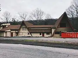 View of large building with gables.