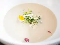 A cheese soup seasoned with herbs.