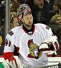 man wearing hockey goaltending equipment