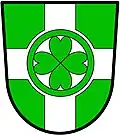 a cross nowy - Vert; a cross nowy, argent, charged with four hearts their points conjoined, within an annulet, vert - City of Chilliwack, Canada