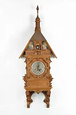 Another eclectic style example, case designed by Robert Bichweiler and crafted by Johann Winterhalder in Urach. The movement comes from Beha und Söhne in Eisenbach, 1885 (Deutsches Uhrenmuseum, Inv. 07–0325).