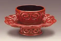 Tuozhan (Cup Stand) in the Form of a Lotus Blossom with Sword-Pommel Pattern, early Ming. Very rounded carving, and a few black layers.