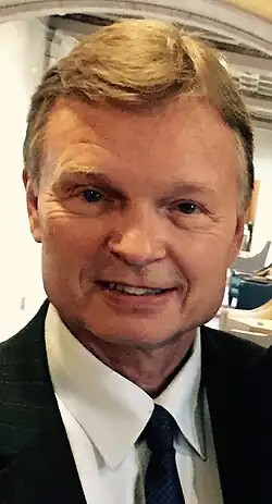 A headshot of Daniel W. Armstrong in a suit