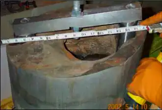 Erosion of the 150-millimetre-thick (5.9 in) carbon steel reactor head at Davis-Besse Nuclear Power Plant, in Oak Harbor, Ohio, USA, in 2002, caused by a persistent leak of borated water