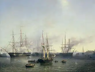 A number of large, tall ships on calm seas. The ship in the center is flanked by a number of smaller rowboats with people on them.