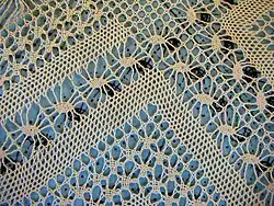 half stitch motifs, spiders, an asymmetrical ground