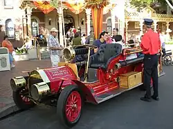 A red turn-of-the-20th-century-style fire engine