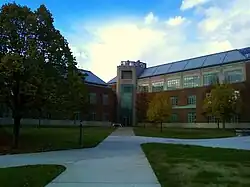 Picture of a three-story building with walkways on an autumn day, The Doane Hall of Chemistry and Steffee Hall of Life Sciences