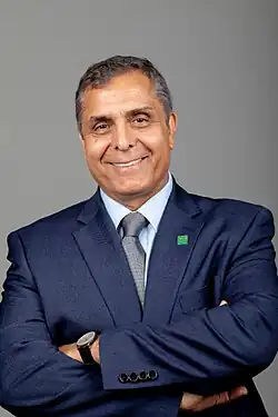 Dr. Mohammad "Mo" Dehghani smiling with his arms crossed facing the camera. He is wearing a suit with a Missouri University of Science and Technology pin and in front of a gray backdrop.