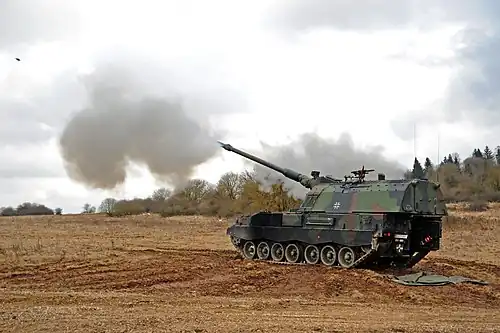 German soldiers with 4th Battery, 131st Artillery Battalion carry out a fire mission with self-propelled howitzers (2018)