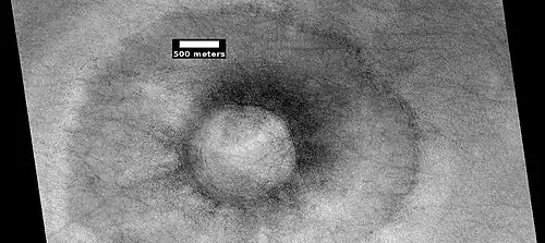 Pedestal crater with boulders along rim. Such craters are called "halo craters".[89] Picture taken with HiRISE under HiWish program.