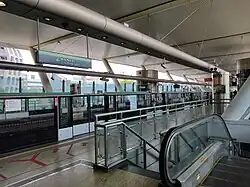 Dover MRT station (Singapore) with two platforms in use. The station is an infill station built along an existing line; thus, it takes a side platform structure.