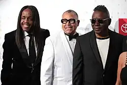 Three men posing for a picture