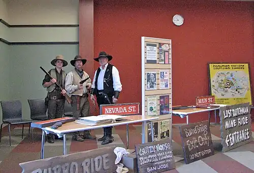Frontier Village enthusiasts and collected memorabilia, primarily ride signs, displayed at the Edenvale Branch of the San Jose Public Library.