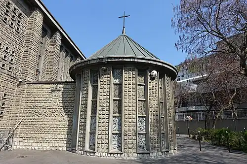 The baptistry, of concrete made to resemble stone