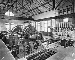 Interior of a powerhouse with several steam turbines