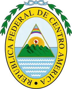 A gold oval with the text "Federal Republic of Central America" in Spanish on top of it; within the oval is contained an equilateral triangle with a rainbow on top, a Phrygian cap with sunbeams emanating from it in the middle, and five rounded volcanos surrounded by two oceans on the bottom