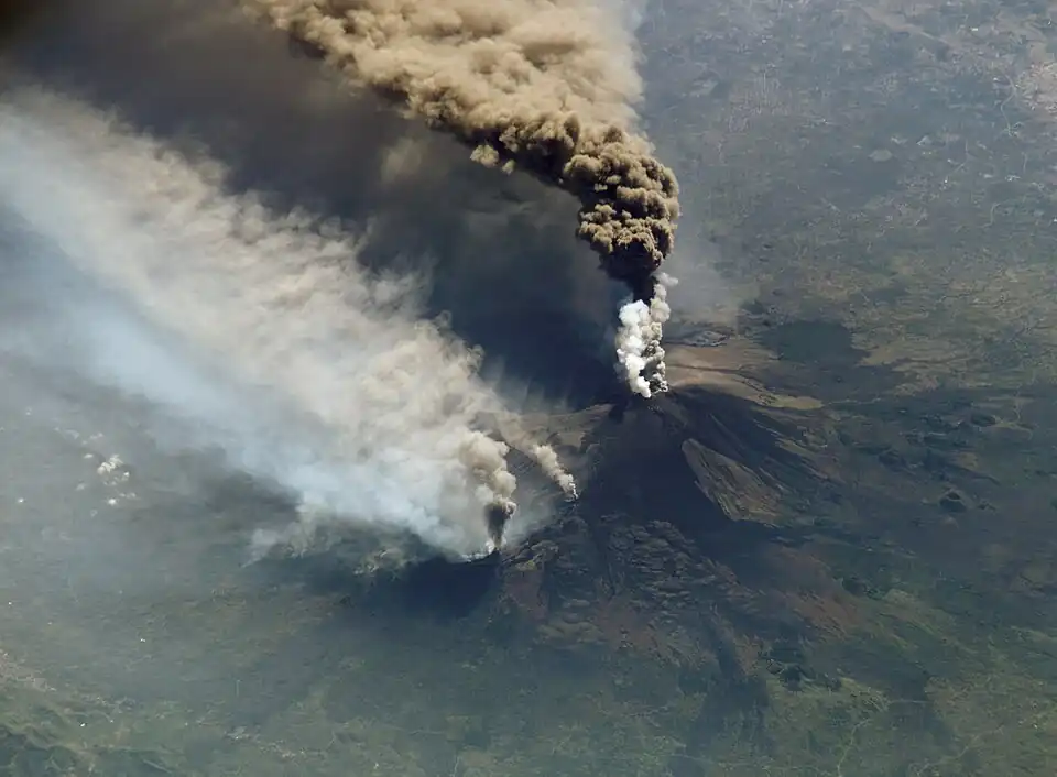Image 58An October 2002 eruption of Mount Etna, a volcano on the Italian island of Sicily, as seen from the International Space Station. Etna is the largest of Italy's three active volcanoes and one of the most active in the whole entire world. This eruption, one of Etna's most vigorous in years, was triggered by a series of earthquakes. Ashfall was reported as far away as Libya, 600 km (373 mi) to the south. (Credit: Expedition 5 crew.) (from Portal:Earth sciences/Selected pictures)