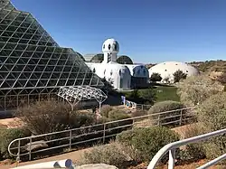 Exterior showing parts of the rainforest biome and of the habitat, with the West lung in the background