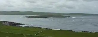 Eynhallow viewed from Rousay, from the north-east, with the Orkney Mainland beyond