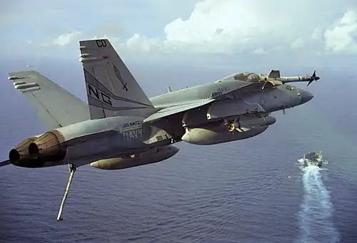 An F/A-18C Night Attack Hornet from VFA-147 Argonauts approaching the USS Nimitz CVN-68 in 1996.