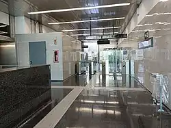 The station's fare gates in the upper access