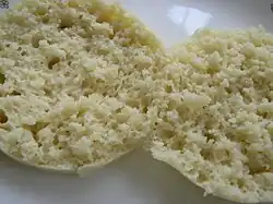 To serve, the muffins are cut in half; the texture has a small and open crumb, and is unlike bread dough.