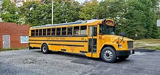Yellow school bus reading "Calvert County Public Schools" along the side