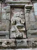 Another desecrated relief (likely Dakshinamurti)