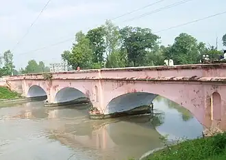 Photograph (2008) of an East India Company-era (1854) bridge on the Ganges Canal near Roorkee, Uttar Pradesh, India.