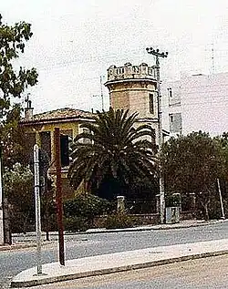 The home of General Ioannis Kalogeras in the old Glyfada neighborhood of Athens featured a tower with ramparts and lush gardens.[48]