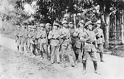 Soldiers marching through the jungle