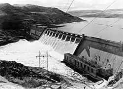 Grand Coulee Dam with water coming over central spillway