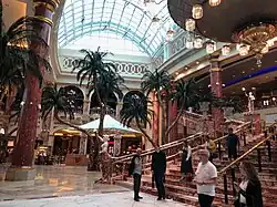 The Great Hall showing the marble staircase, chandelier and palm trees