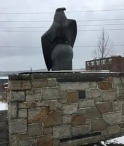 The Greendale War Memorial which consists of a sculpture of an eagle atop a globe made of granite. The memorial is located on West Boylston Street in Worcester, Massachusetts.
