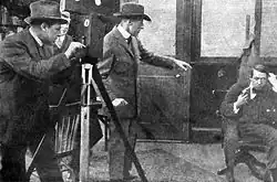 Black and white photograph of film director on set