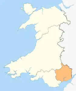 A map of Wales in yellow with a small area in green (about 5%) at the bottom right (south east)