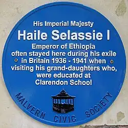 A blue plaque, unveiled in 2011 in Great Malvern, England