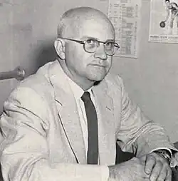 A black-and-white head shot of Harlan Hodges