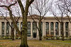 A building behind trees
