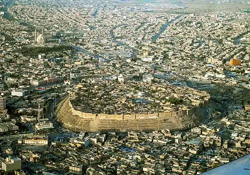 Aerial view of the Citadel of Erbil, surrounded by the modern city