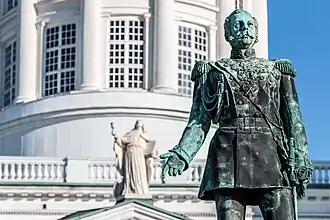 Close-up from the front with Helsinki Cathedral's John the Apostle in the background