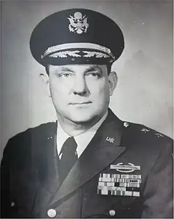 1953 black and white head and shoulders photo of Major General Henry K. Fluck in dress uniform and cap