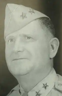 Black and white head and neck left profile photo of Major General Herman F. Kramer in dress uniform and cap