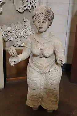 Semi-nude female figure