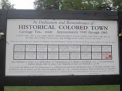 Historical marker commemorating Colored Town, a black business section that had its prime from 1940 to 1965, from East Panola to Live Oak streets
